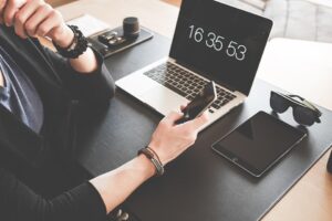 Table with laptop, tablet and mobile phone